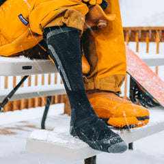 Darn Tough Edge worn inside snowboard boot, secure fit and protection