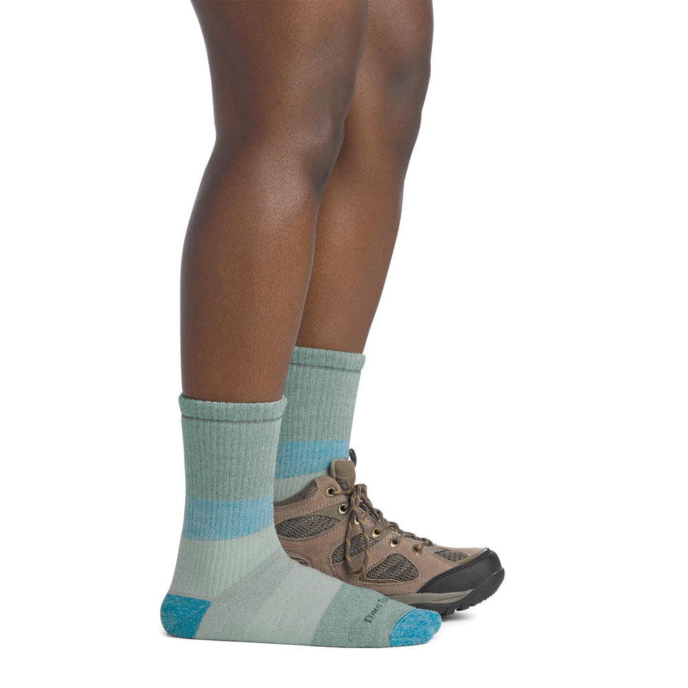 Darn Tough sock on model in snowy setting showing warmth and durability