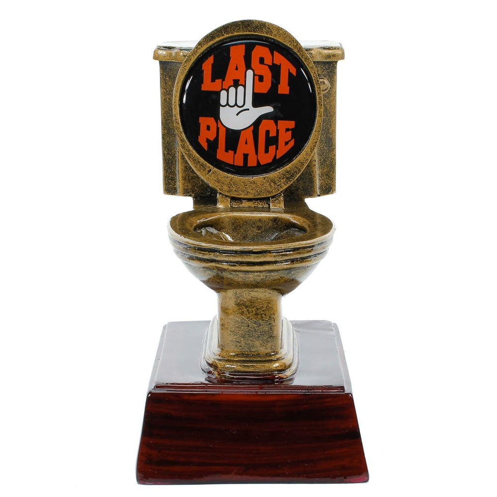 Decade Awards trophy staged at a party table as a humorous last-place prize and conversation starter
