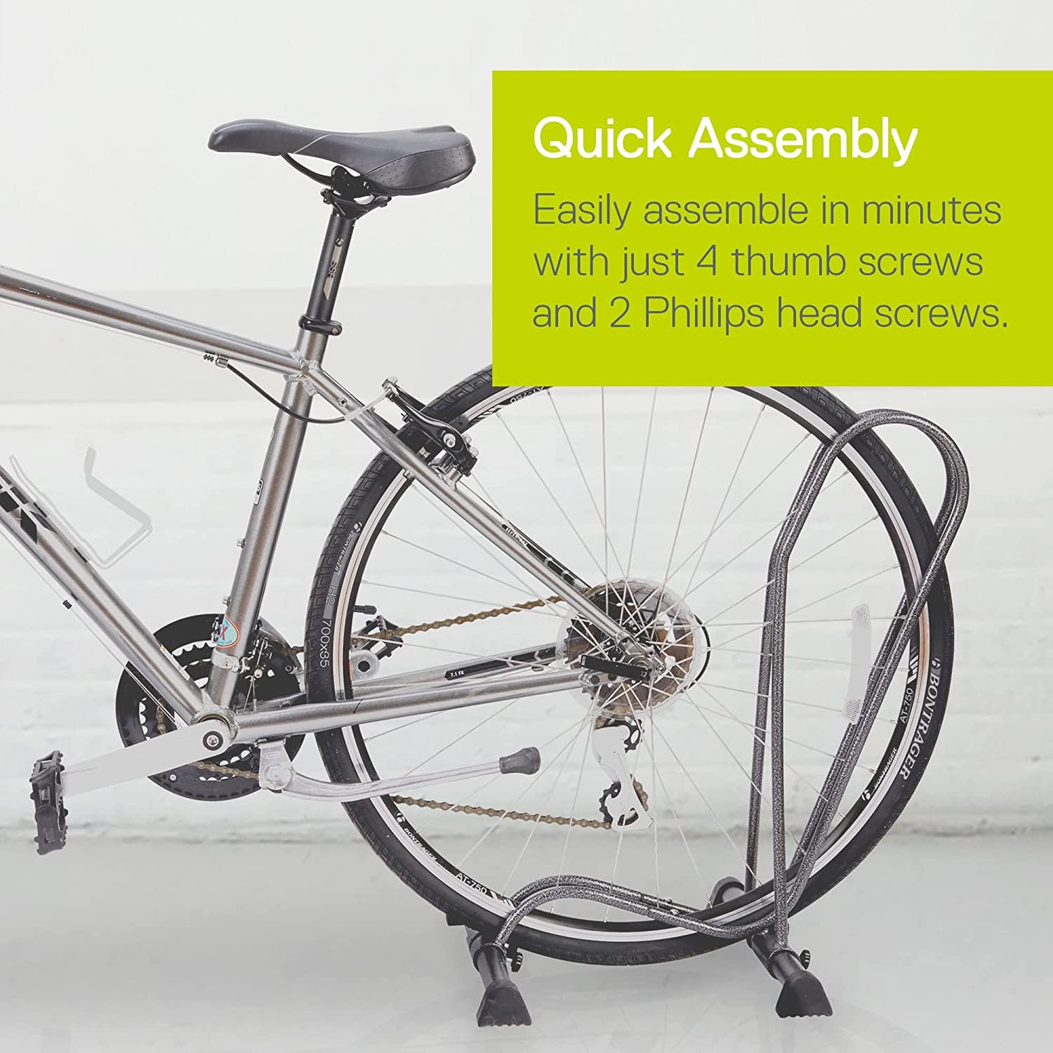 Delta stand next to full-size bicycle showing scale and space-saving benefit