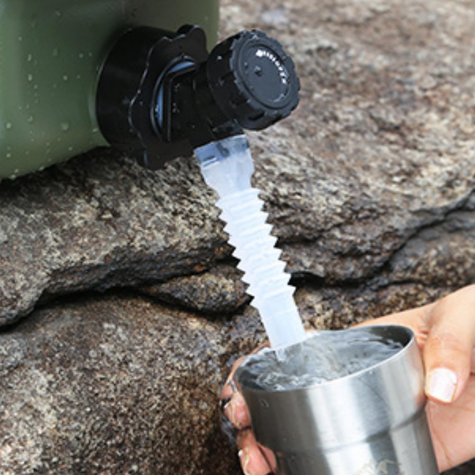 Dicunoy next to hand for scale, showing 3-gallon capacity manageable weight