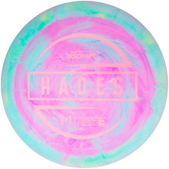 Discraft Hades in play mid-throw demonstrating distance potential and stable finish benefit