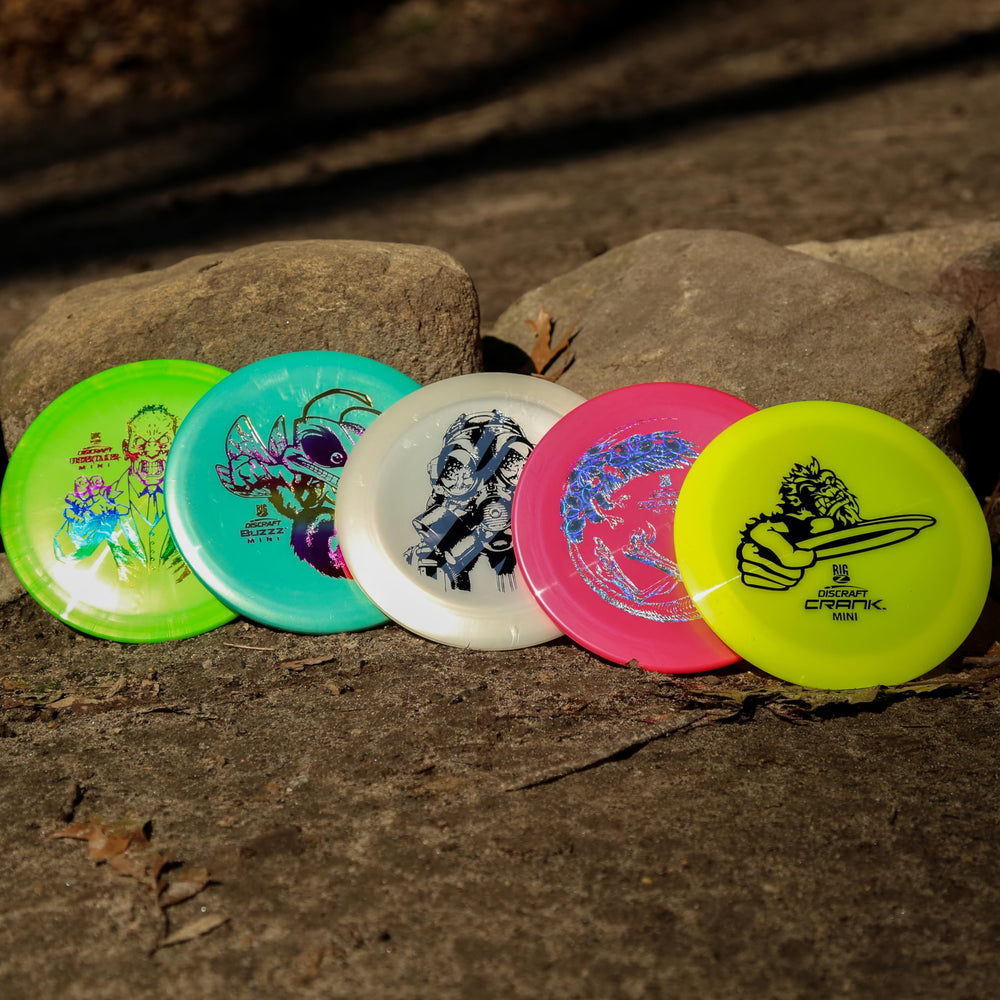 Discraft mini big z in hand scale comparison showing portability and pocket-ready benefit