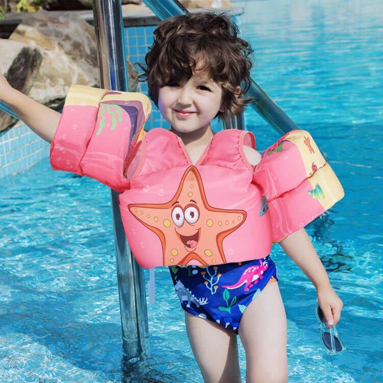 DOOHALO float in family beach scene, supporting safe supervised water play