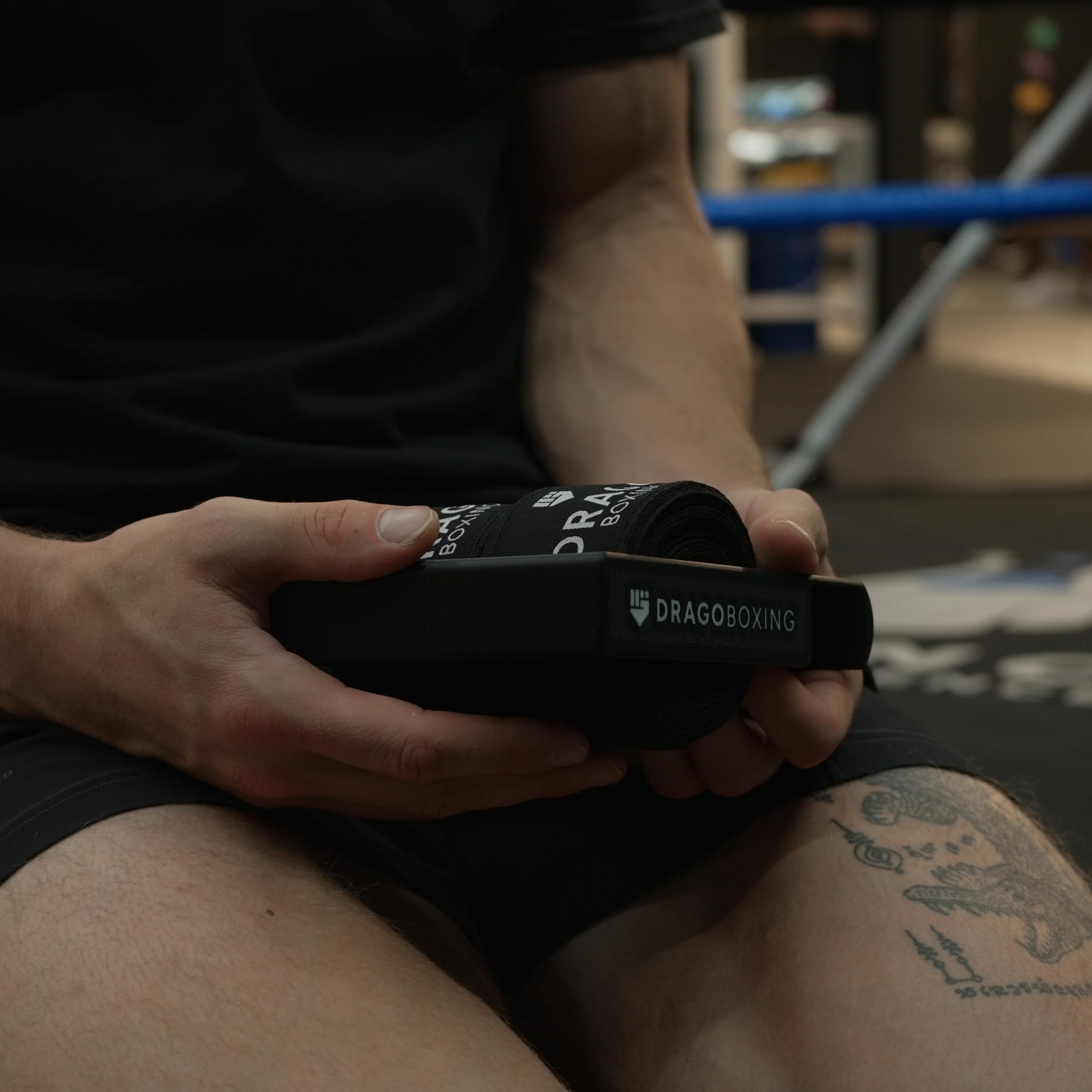 Drago Boxing lifestyle image of an athlete using the roller and hanger for quick gym cleanup and organized gear