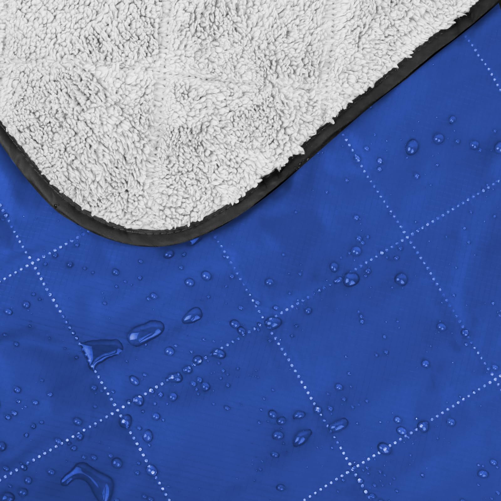 DUKUSEEK blanket worn at stadium demonstrating wearable warmth and hands-free use