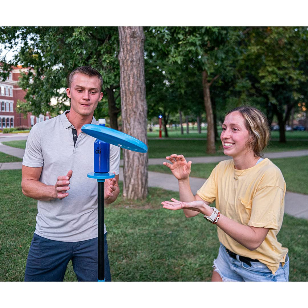 D·D DYNAMIC DISCS evening backyard scene with game setup conveying social outdoor enjoyment