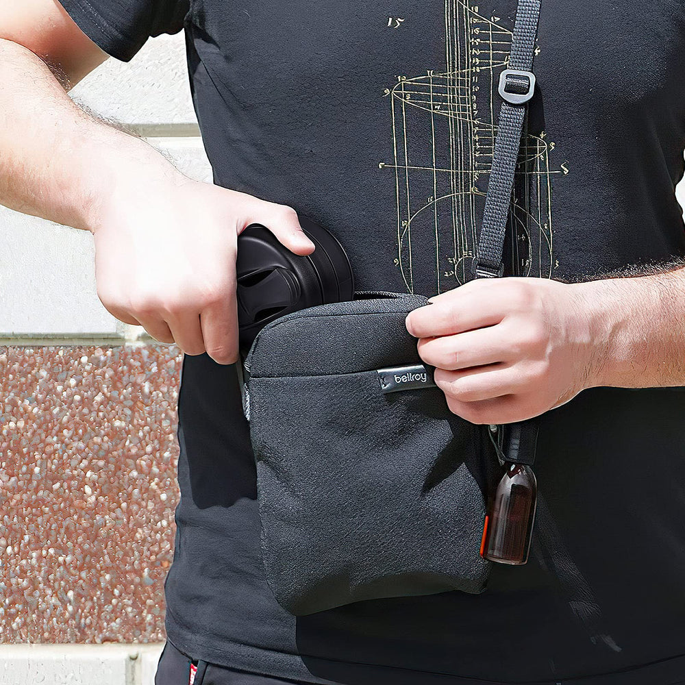 EASYXQ cup hooked to backpack strap showing hands-free carry benefit