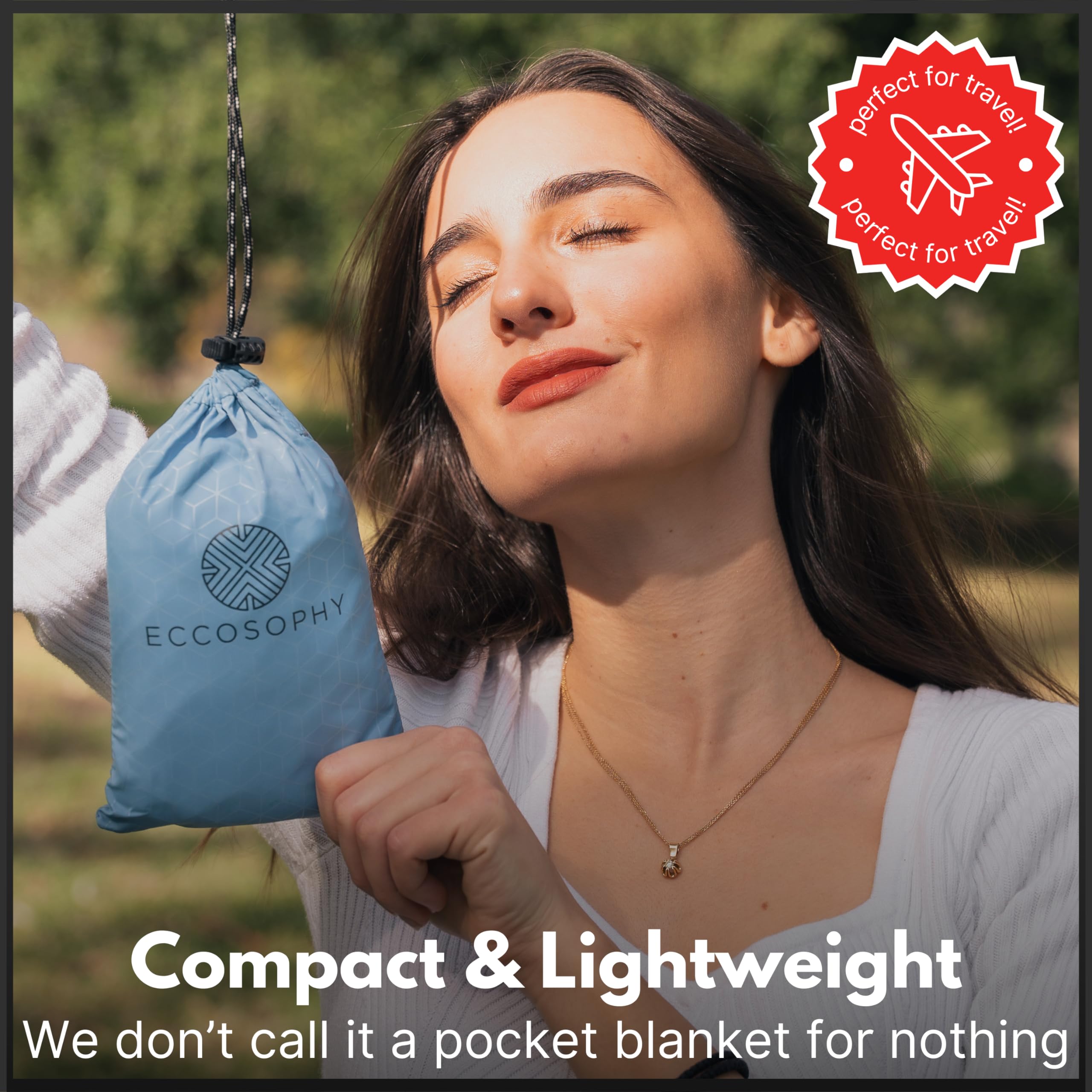 ECCOSOPHY blanket next to backpack shows compact size and travel convenience