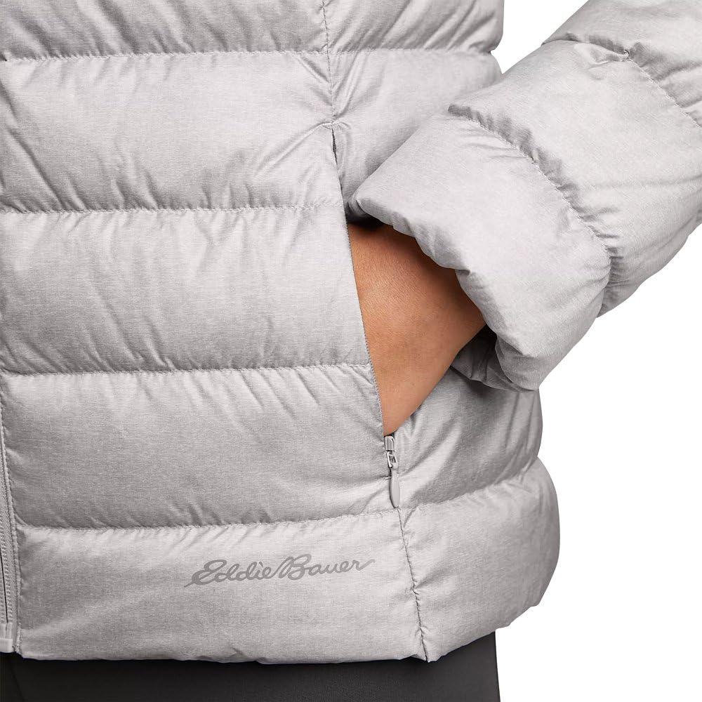 Eddie Bauer jacket compressed in hand demonstrating packability for travel