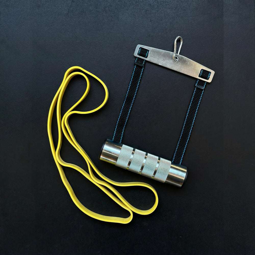 Elymays handle attached to a cable machine demonstrating safe, heavy-load training