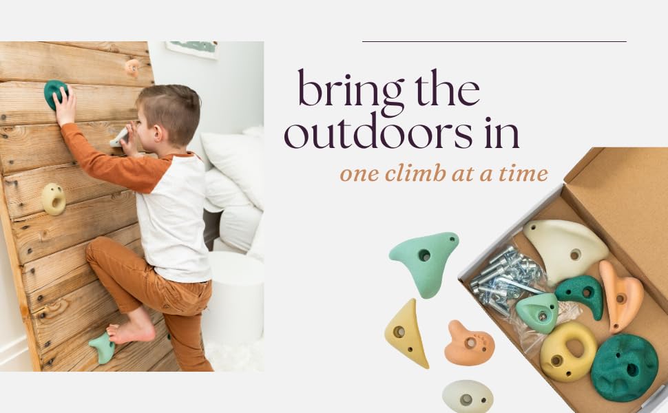 Everett & Avery Co. child climbing a wall using holds showing safe engagement and skill-building benefit