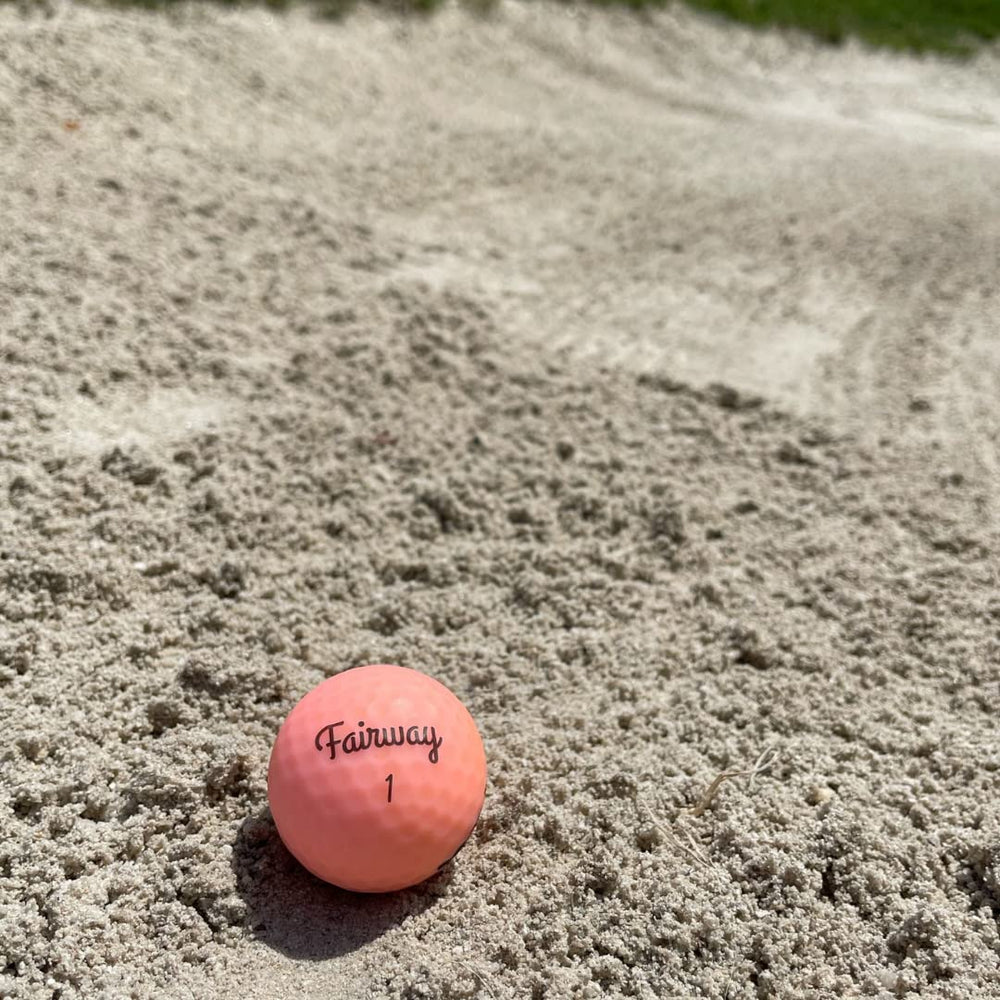 Fairway Golf player holding ball before tee shot highlighting comfort and feel