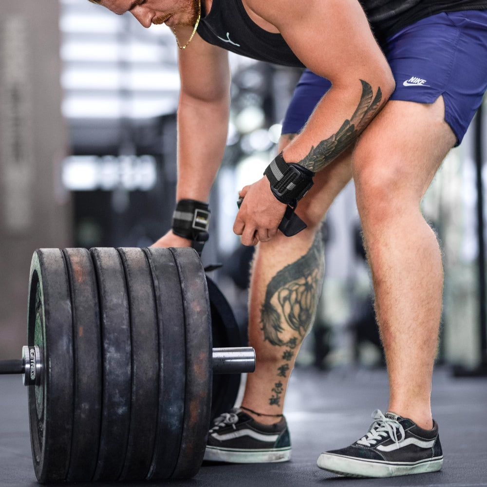 FightTech lifestyle shot with athlete at gym showing confidence and performance