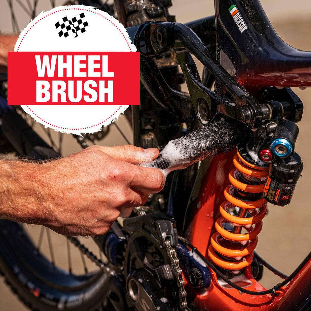 Finish Line stiff cassette brush scrubbing cassette cogs to remove built-up grime