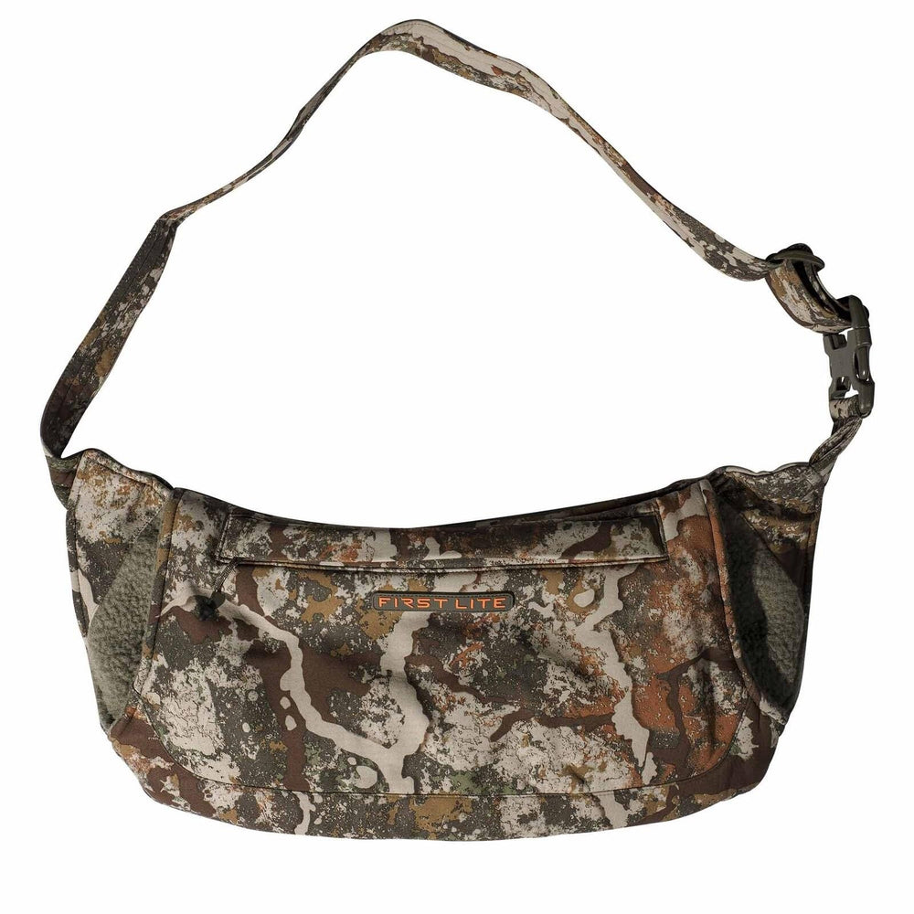 First Lite Specter front view showing windproof shell and pocket for warmth
