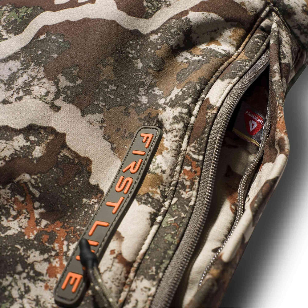 First Lite Specter muff worn on treestand keeping hands warm and ready