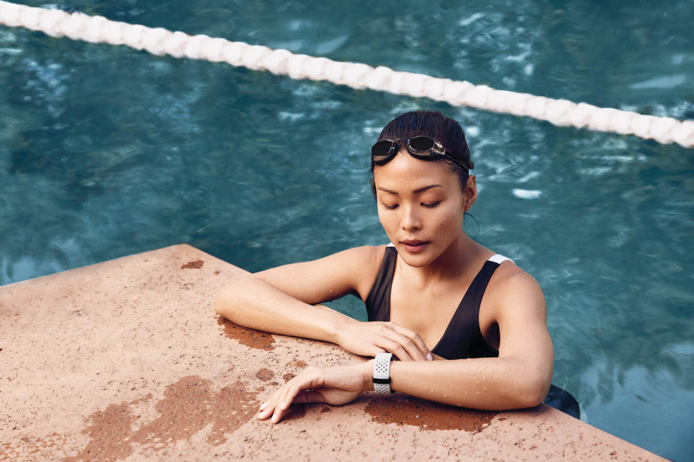 Fitbit Charge 3 SE in-pool swim shot demonstrating water resistance and swim tracking benefit