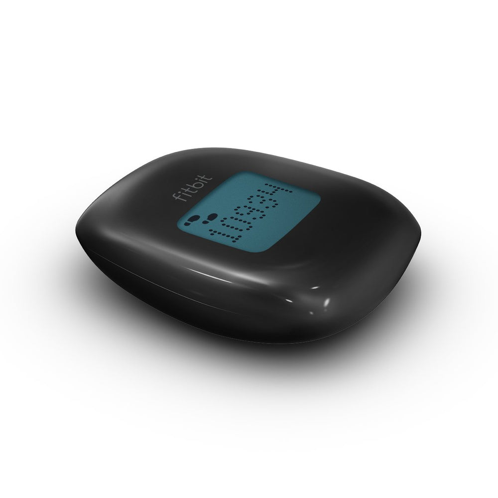 Fitbit Zip syncing to a laptop illustrating wireless data transfer and effortless updates