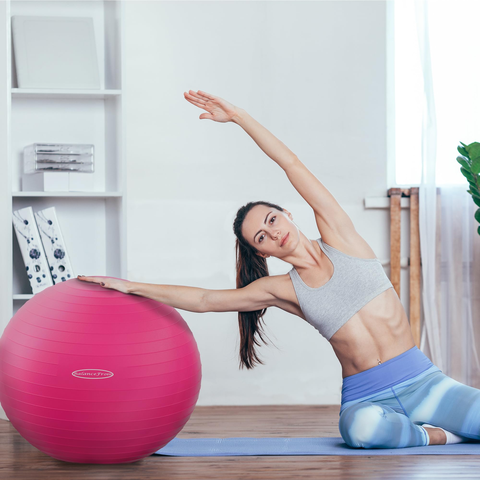 Fitvids ball used for birthing support showing comfortable pelvic positioning