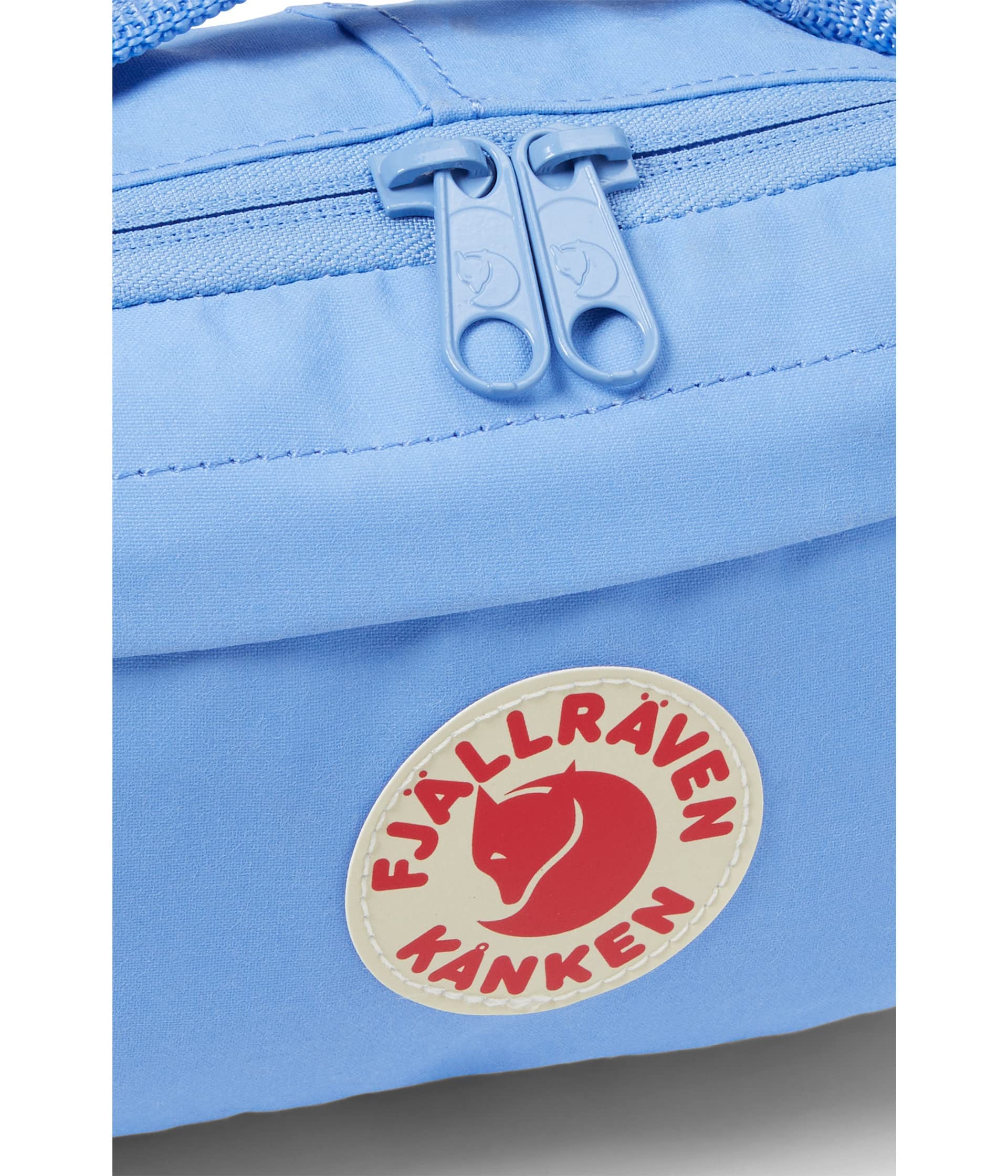 Fjällräven pack open displaying main compartment, interior pocket and key clip for organization