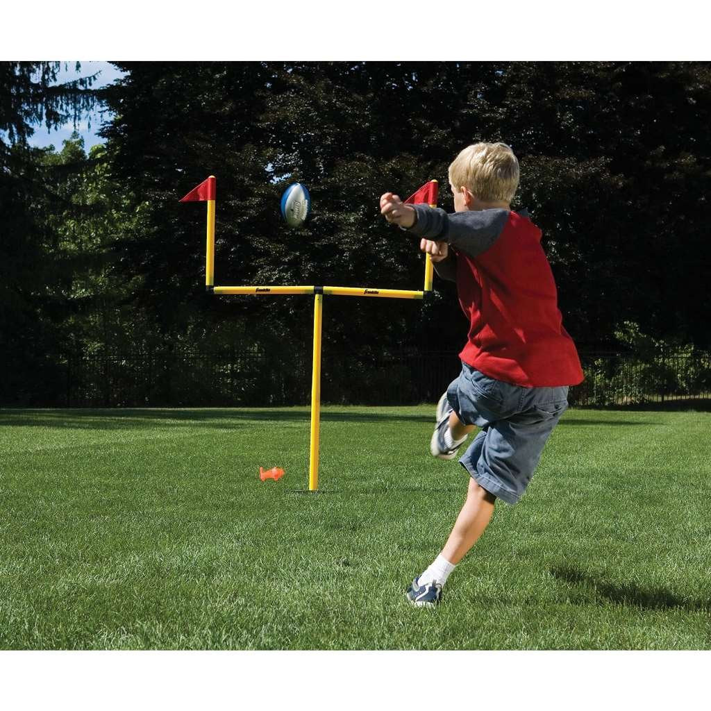 Franklin Sports goal posts assembled in a backyard for portable family play
