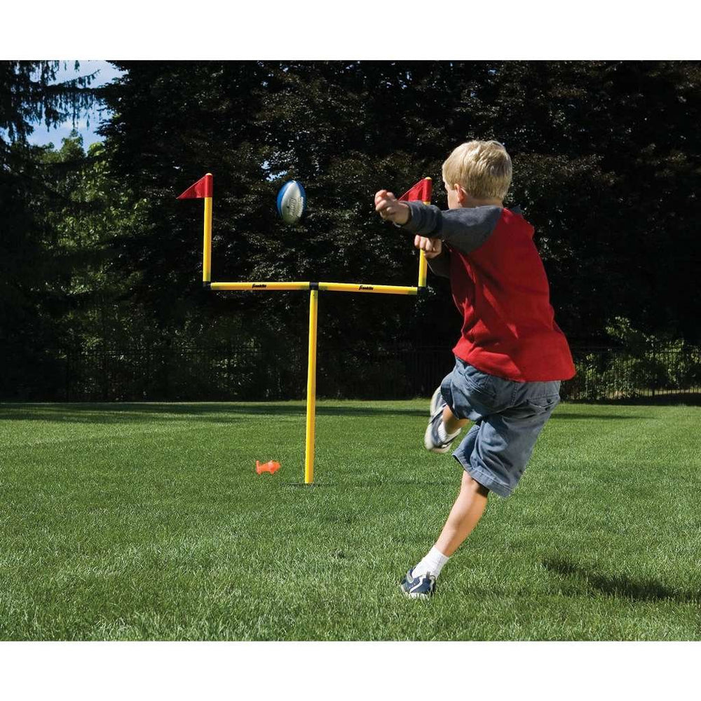 Franklin Sports goal posts assembled in a backyard for portable family play