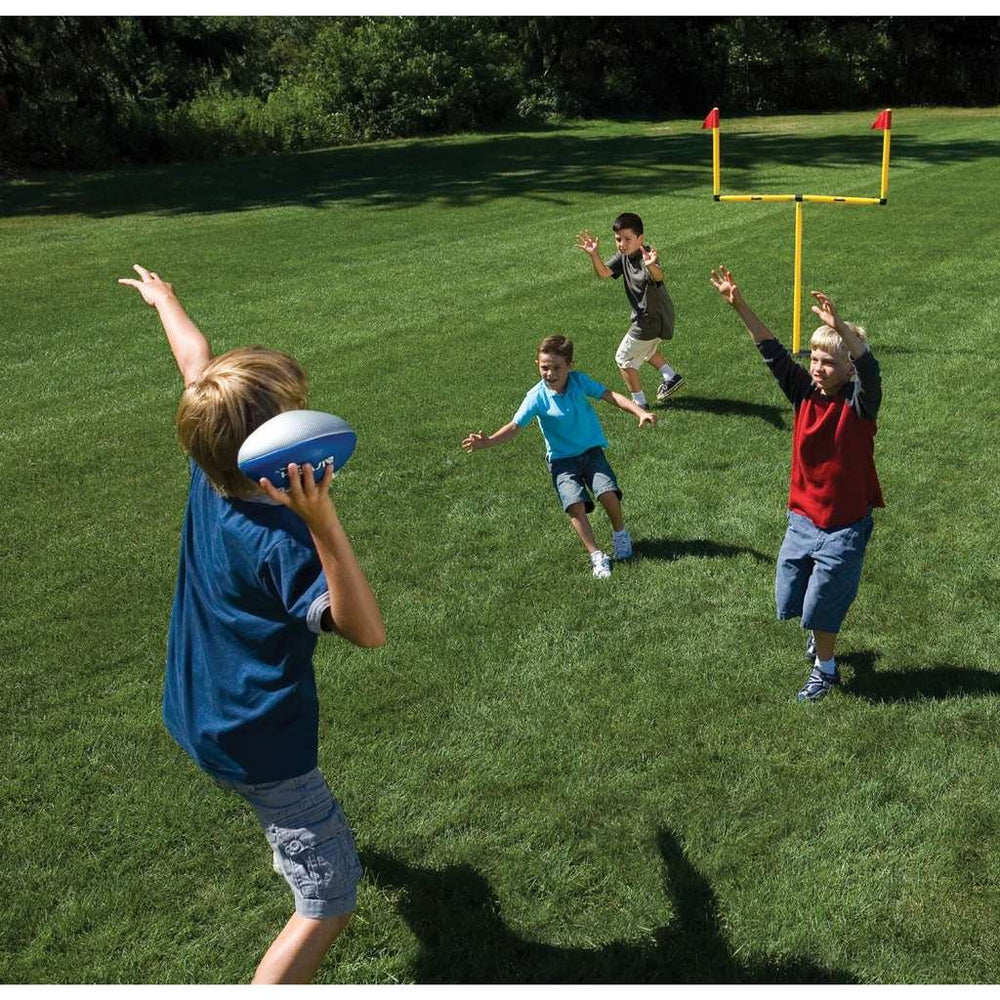 Franklin Sports kids kicking toward goal posts illustrating practice and fun