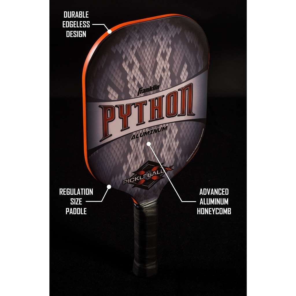 Franklin Sports X-Factor beside a ball for scale showing balanced paddle weight