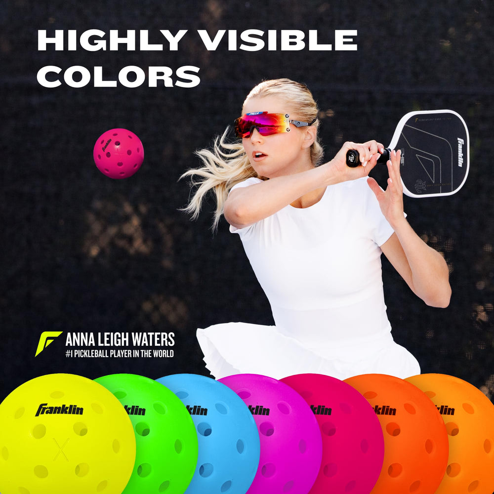 Franklin Sports X-40 beside ruler showing official 74mm size accuracy
