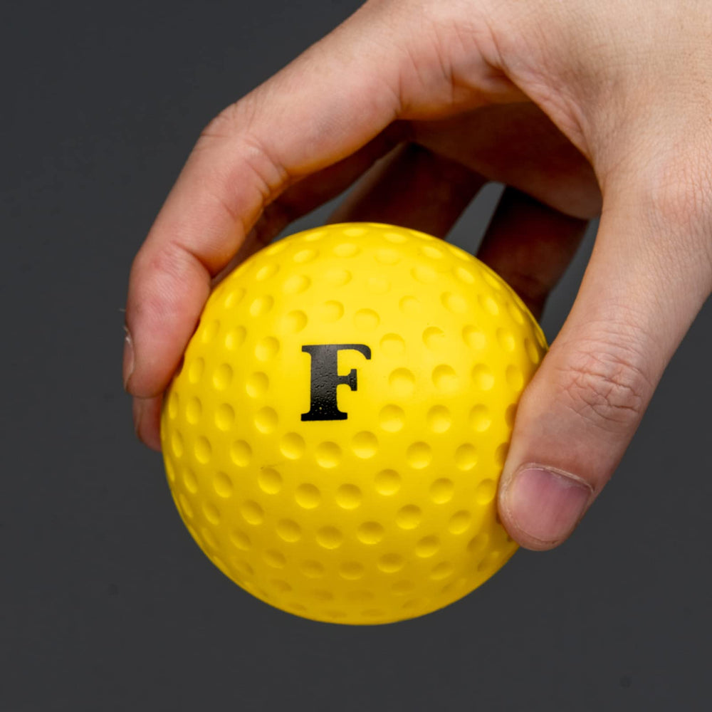 Furlihong ball held in hand for scale showing 2.9-inch diameter and lightweight 1 oz design