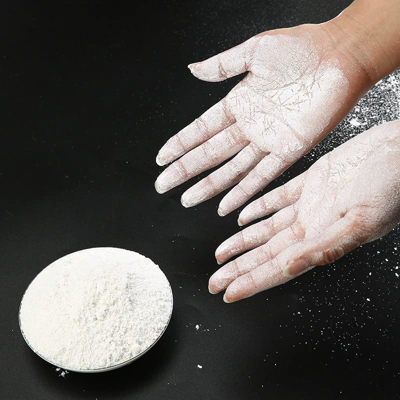 Fuyatina athlete using chalk on bar to improve grip during weightlifting session
