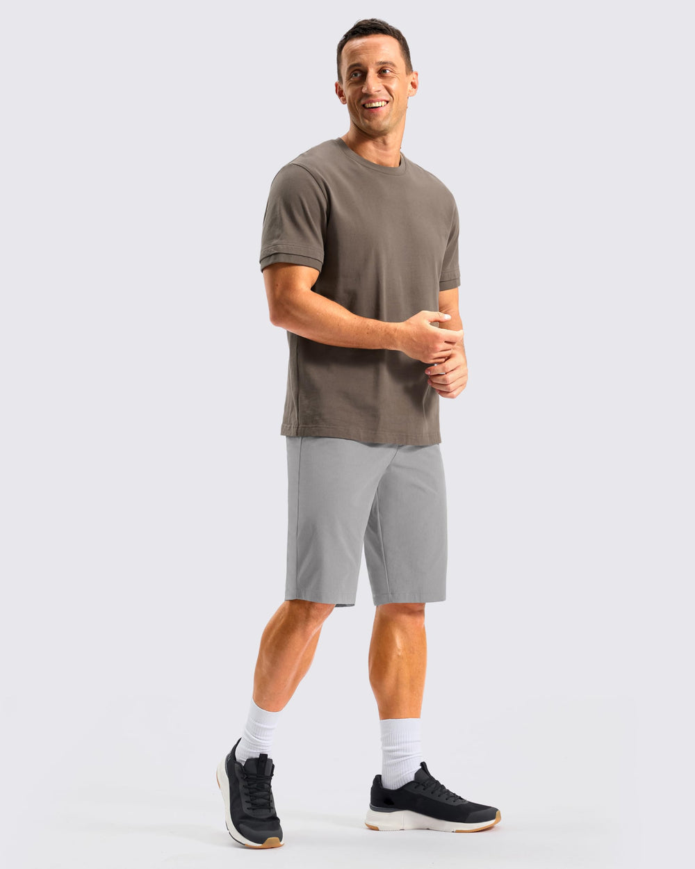 G Gradual shorts on model next to measuring tape showing size clarity benefit