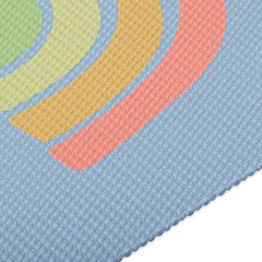 Gaiam kids yoga mat next to a child for scale showing appropriate 60 by 24 inch size benefit