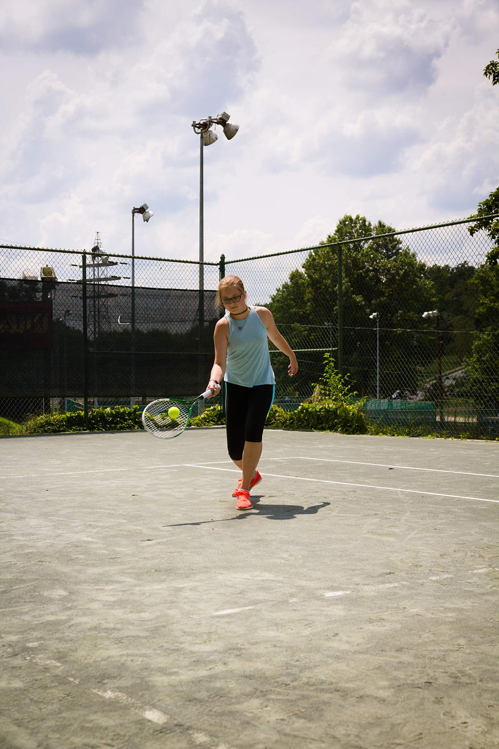 GAMMA lifestyle shot court scene with junior player emphasizing practice and skill development