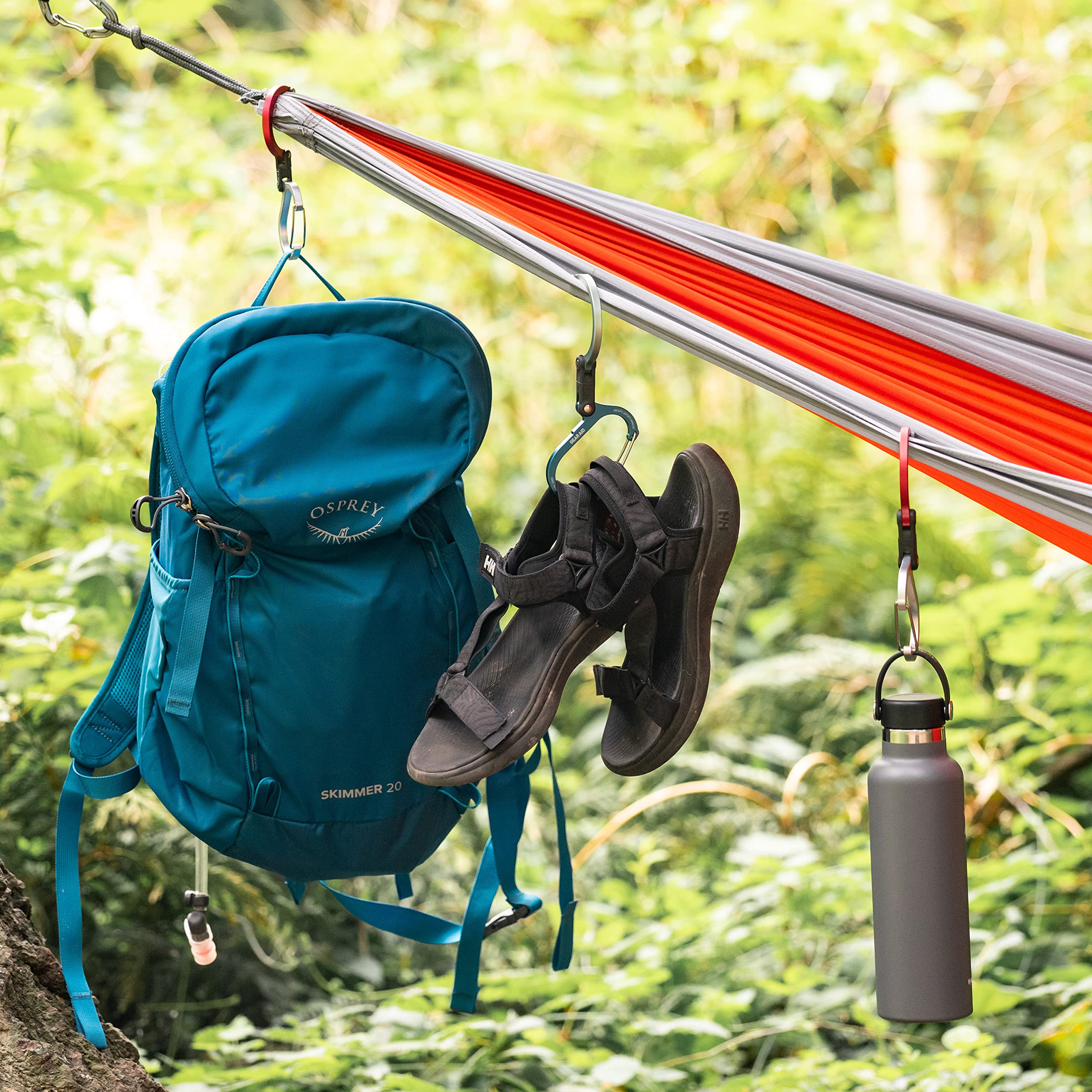 GEAR AID HEROCLIP beside a smartphone to show medium size and portability