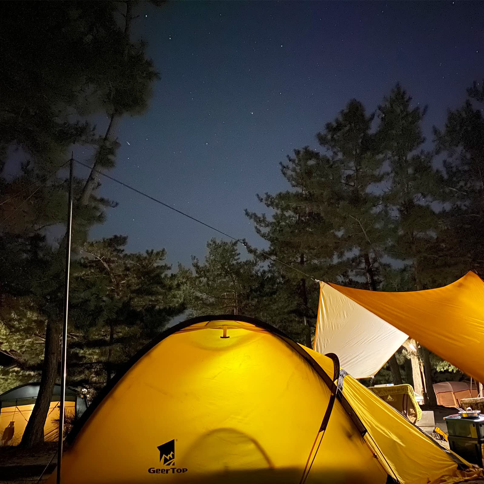 GEERTOP packed tent next to backpack showing compact transport benefit