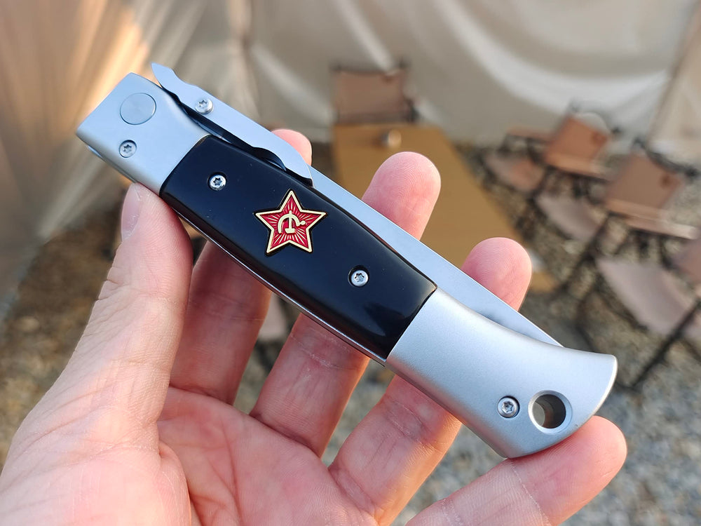 Generic Finka-NKVD close-up of mirror-polished X12M blade highlighting edge durability