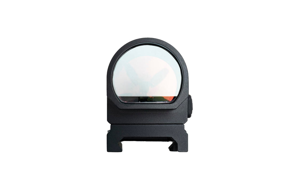 Gideon Optics Omega next to coin showing lightweight, pocketable size