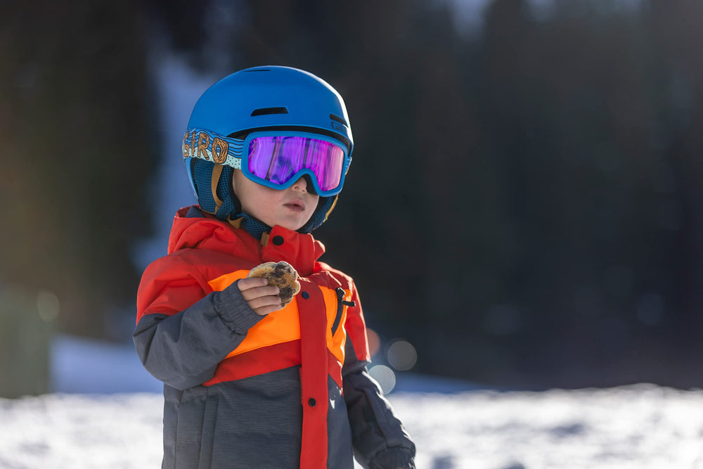 Child wearing Giro Buster goggles on slope showing expanded peripheral awareness