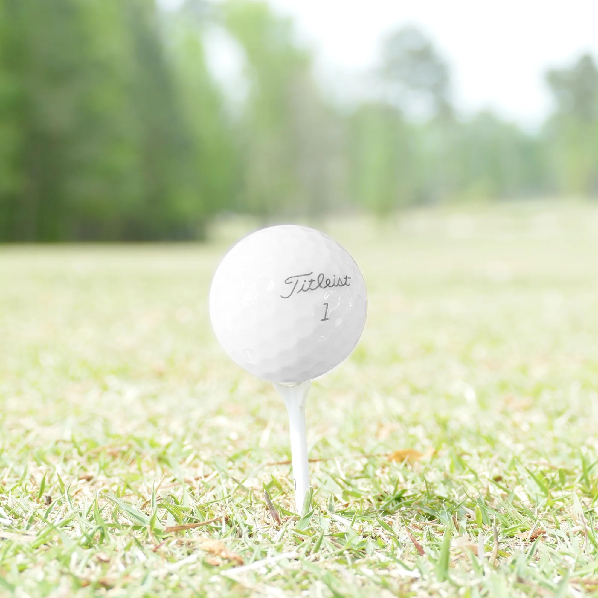 GolfBall Nut practice balls spread on a driving range turf showing reliable flight for drills and training