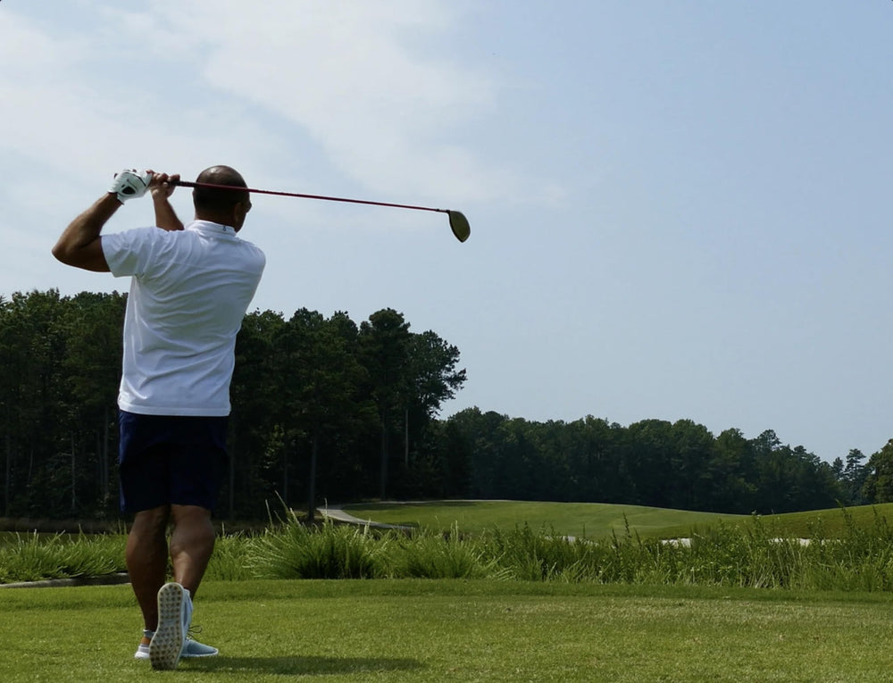 GolfBall Nut practice range scene with balls and golfer demonstrating affordable practice