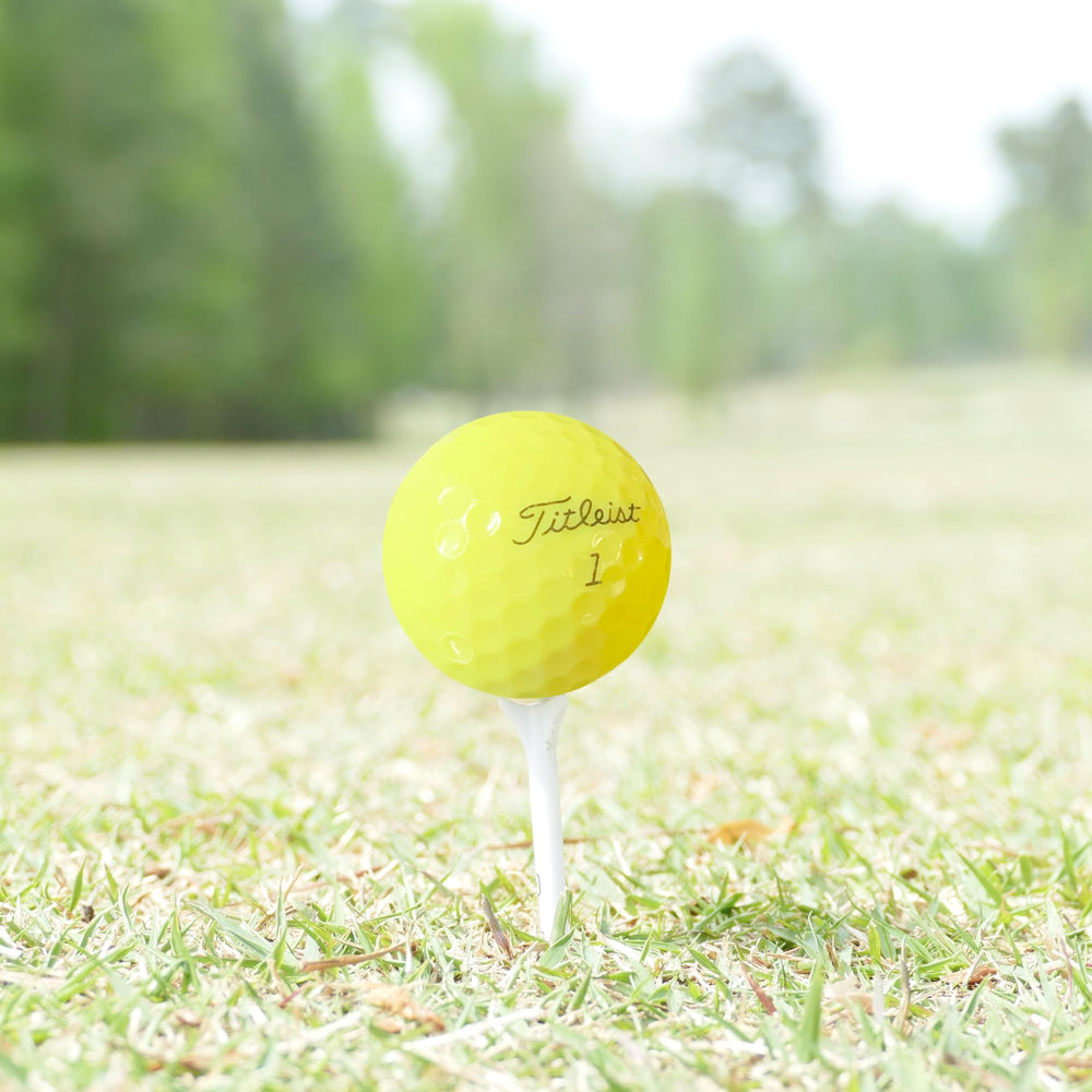 GolfBall Nut stacked pile of balls displaying bright yellow color for easy tracking
