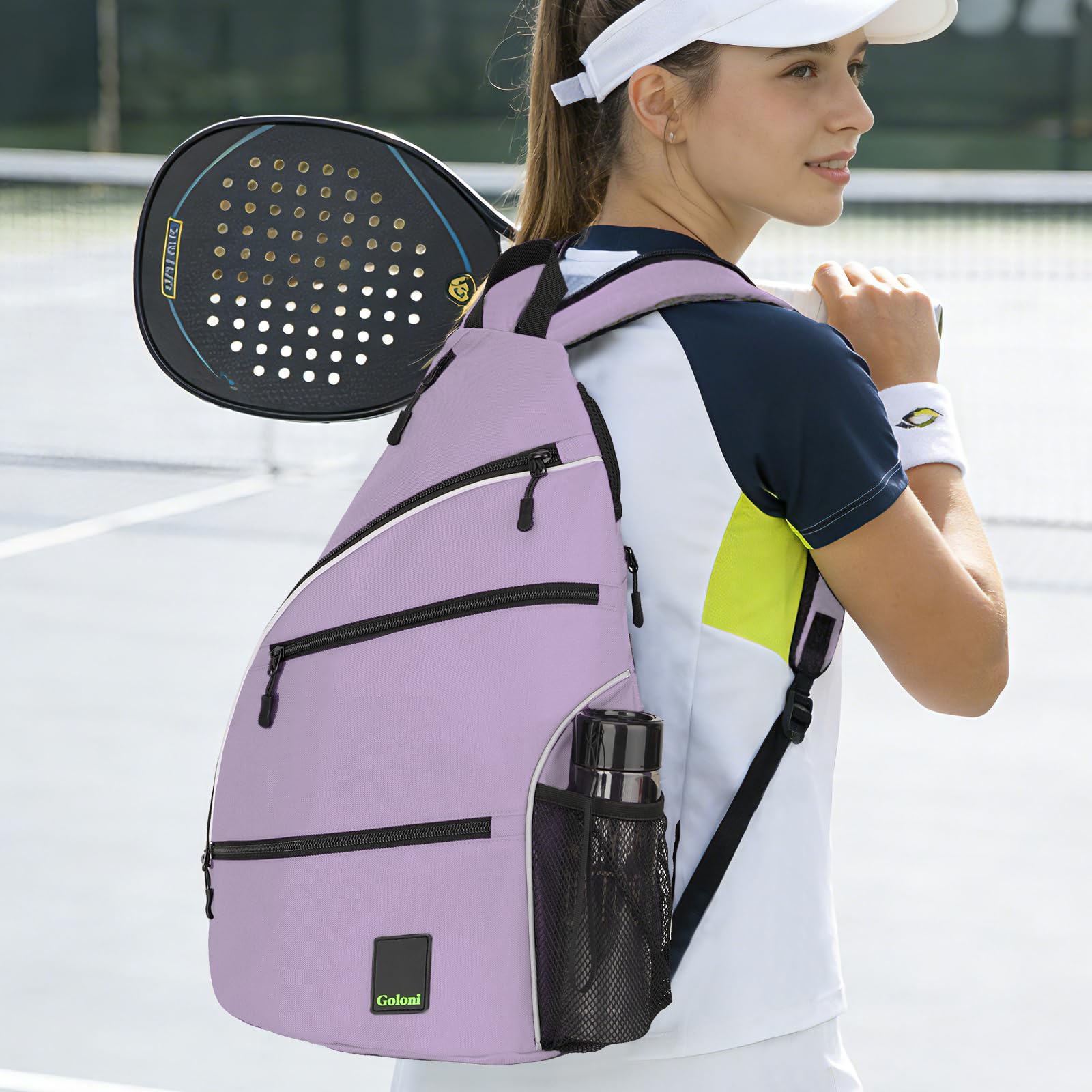 Goloni bag hung on a tennis fence demonstrating hands-free court storage