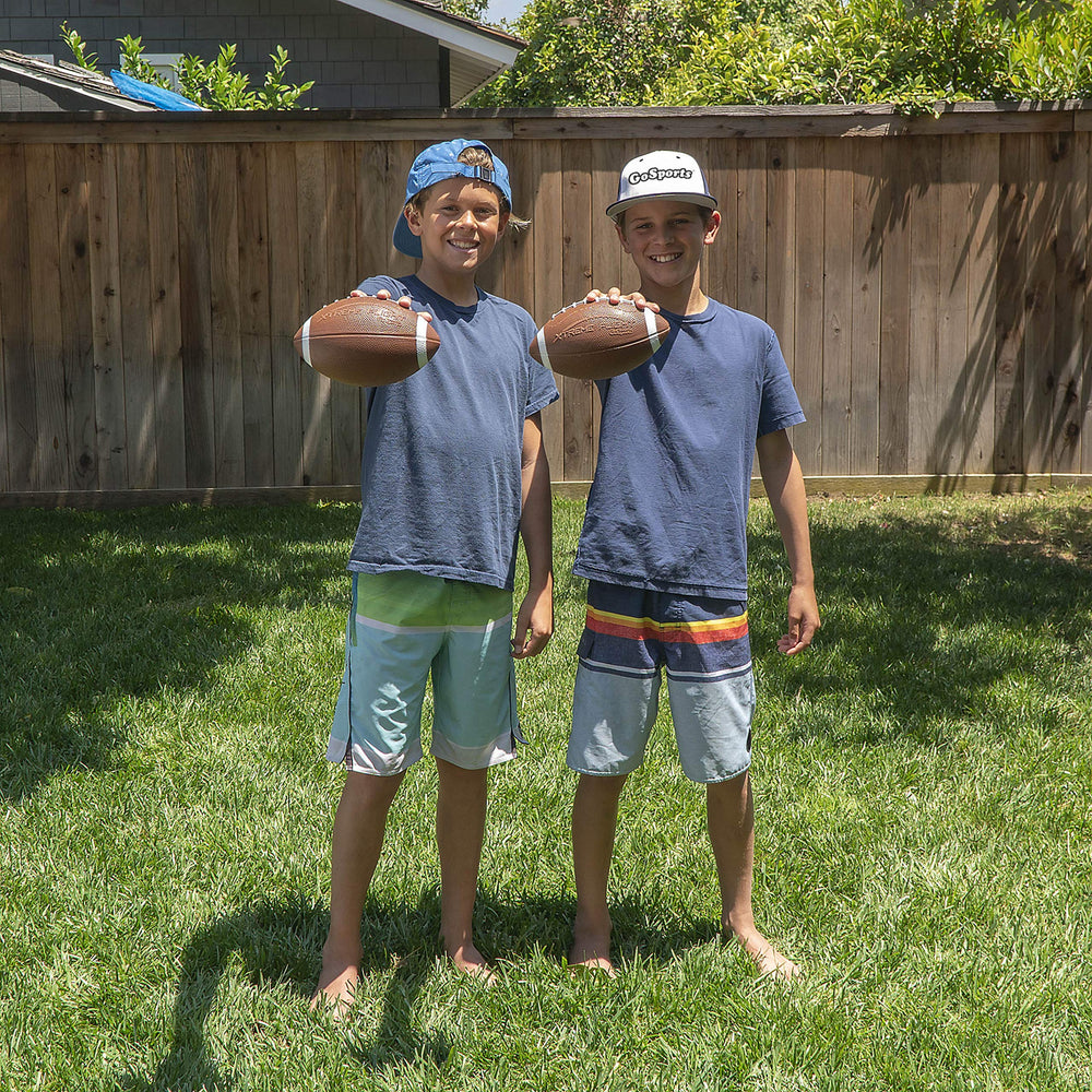 GoSports football in use during backyard game showcasing durable play
