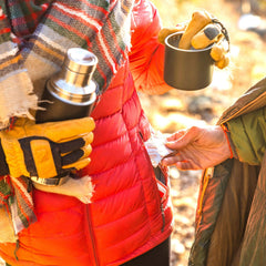 Grabber hand warmer next to ruler for size scale and portability