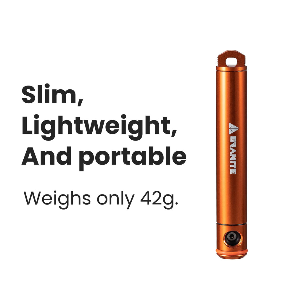 Granite Suture Aero beside a coin showing compact scale and easy portability
