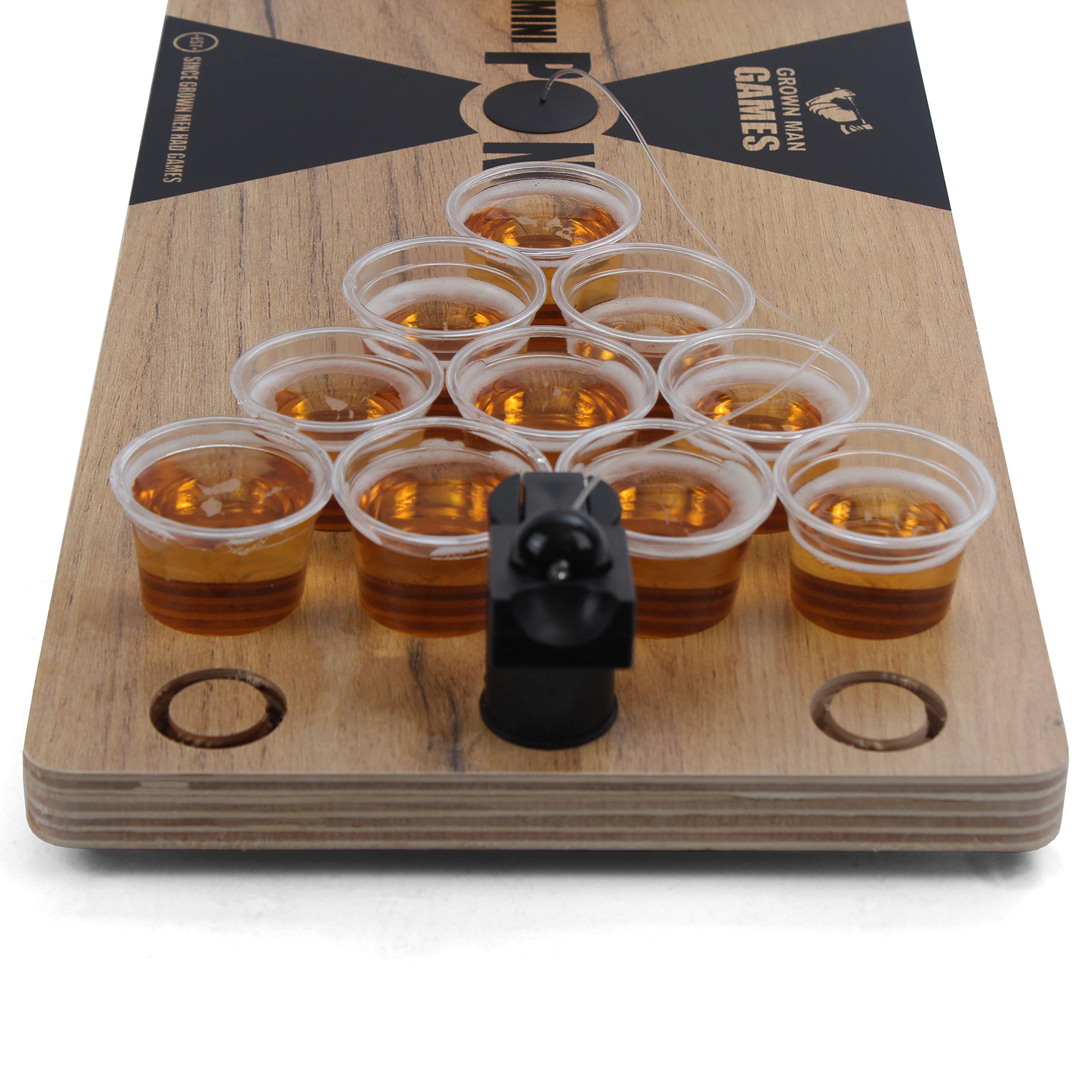 Grown Man Games size comparison with hand to show portability and easy transport for gatherings