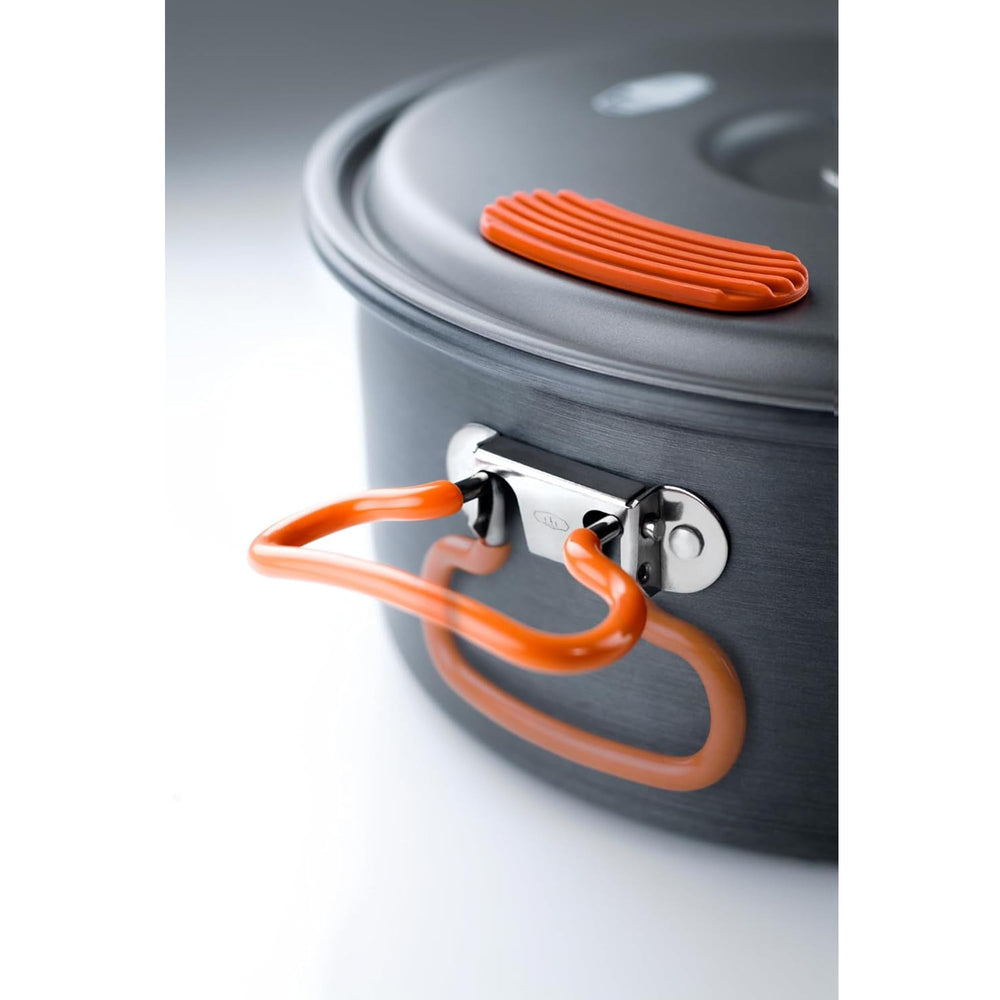 GSI Outdoors pot simmering over camp stove demonstrating efficient heat distribution and fuel savings