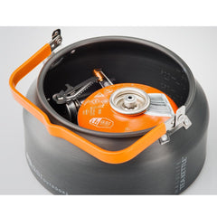 GSI Outdoors kettle in hand to show scale and lightweight packability benefit